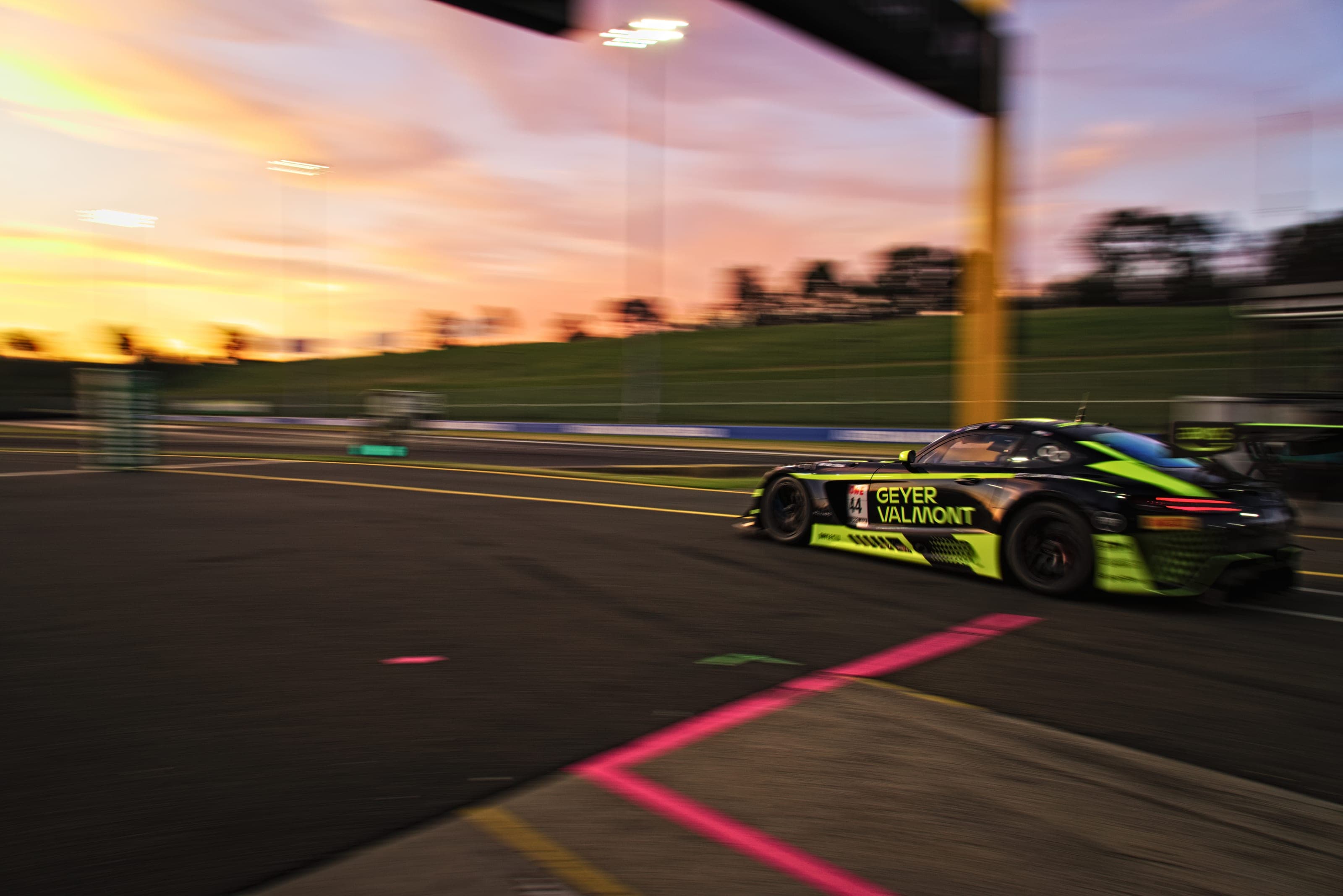 Geyer Valmont GT3 car exiting pit lane at dusk, Bathurst